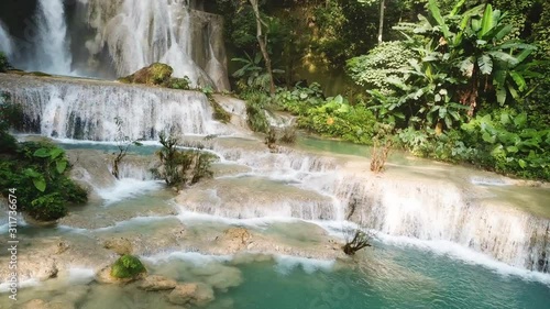 Magical Natural Pool Under Exotic Waterfall in Rainforest, Panoramic Aerial. Kuang Si Falls, Laos Asia