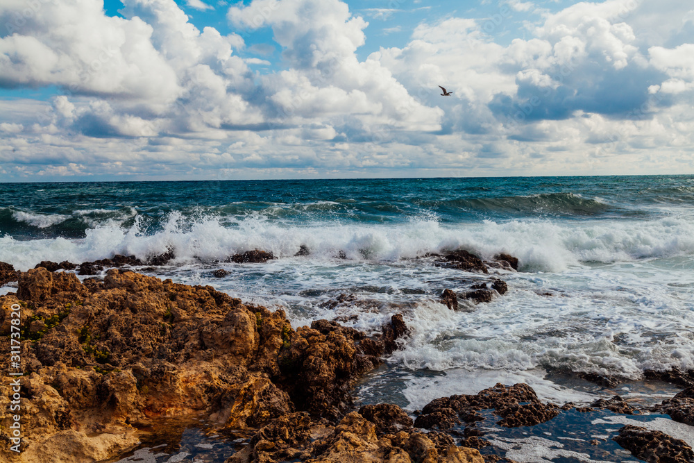 the stone Beach ocean wave sky with clouds the stone Beach ocean wave sky with clouds