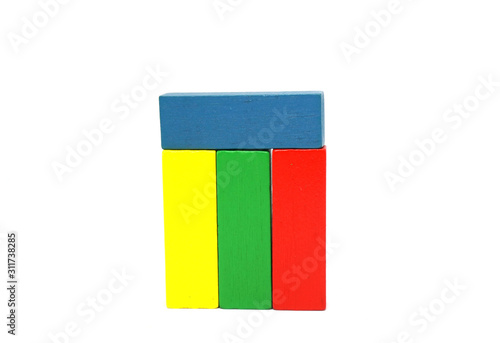 Wooden Kids Toys or jigsaw wooden for Develop children's skills arrange isolated on white background - red yellow green blue color  photo