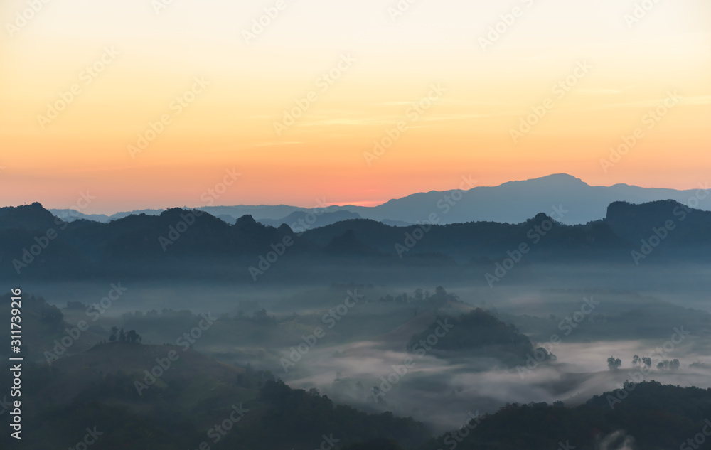 Landscape images of Sky, mountain complex and white mist that swaying in the morning, on the high mountains in northern Thailand, to travel and nature background concept.