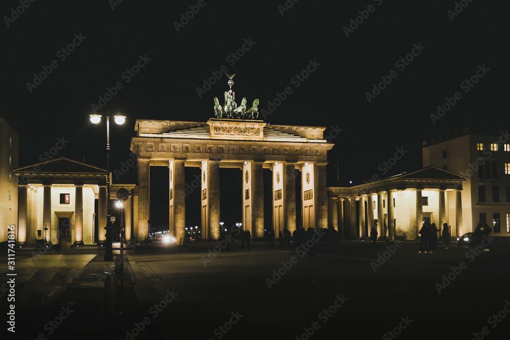 Fototapeta premium Brandenburg gate at night. Berlin landmark. Travel and tourism in Berlin concept.