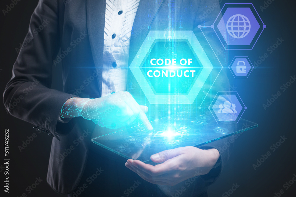 Business, Technology, Internet and network concept. Young businessman working on a virtual screen of the future and sees the inscription: Code of conduct Business, Technology, Internet and network concept. Young businessman working on a virtual screen of the future and sees the inscription: Code of conduct