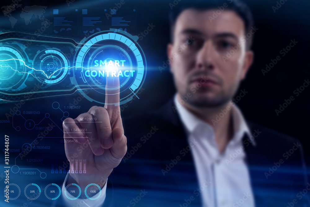 Business, Technology, Internet and network concept. Young businessman working on a virtual screen of the future and sees the inscription: Smart contract Business, Technology, Internet and network concept. Young businessman working on a virtual screen of the future and sees the inscription: Smart contract