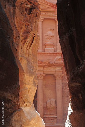 Al Khazneh in the ancient city of Petra, Jordan during the day. It is known as The Treasury. Petra has led to its designation as a UNESCO World Heritage Site. Seven wonder of world