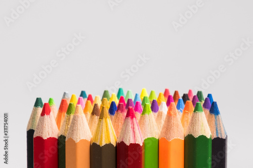 colorful color pencils on white background. multicolor for artist's painting, children's lesson, student's learning