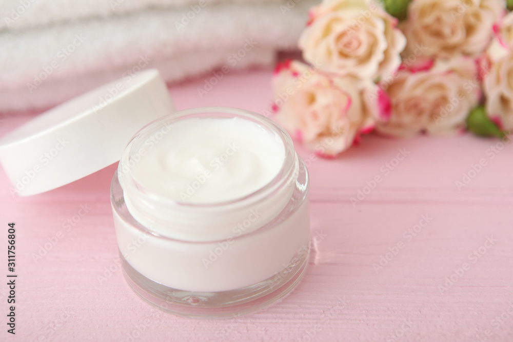 skincare cream and flowers on the table. Cosmetics for skin care. skincare cream and flowers on the table. Cosmetics for skin care.