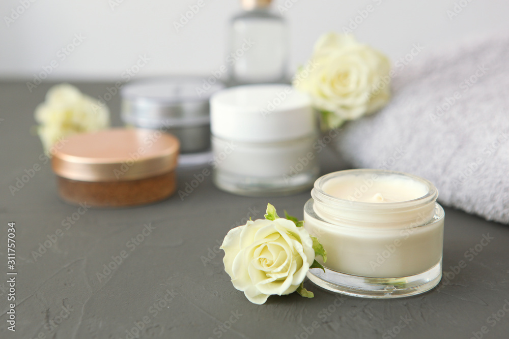 skincare cream and flowers on the table. Cosmetics for skin care. skincare cream and flowers on the table. Cosmetics for skin care.
