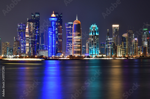 West Bay panorama at night from the Gulf in Qatar, Doha © olgavolodina