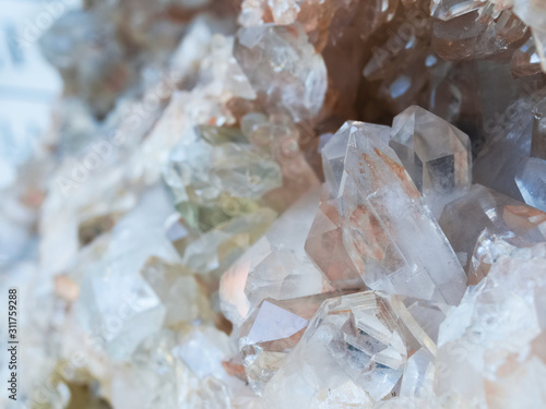 Background, smoky quartz crystals cluster close-up, in the rock. The most common mineral	