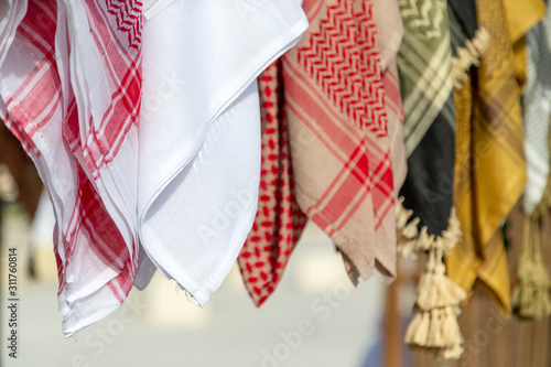 Different style of male head wear at the traditional market in Abu Dhabi photo