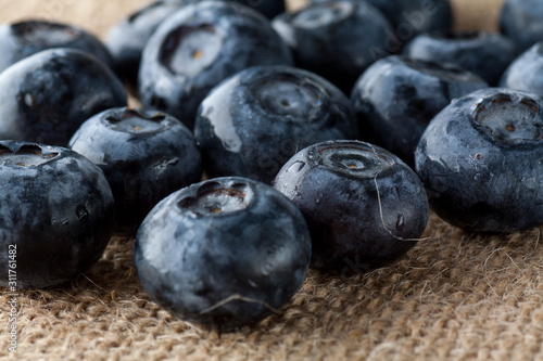 Freshly picked blueberries in burlap background.Concept for healthy eating and nutrition