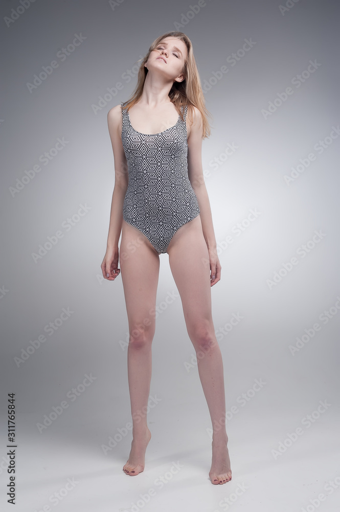 Naklejka premium Attractive sad girl over grey