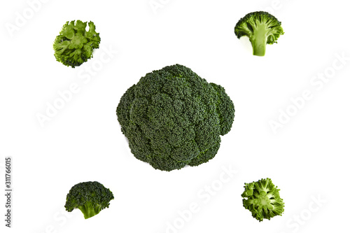 Fresh green broccoli, a type of cauliflower. Isolated on a black background.