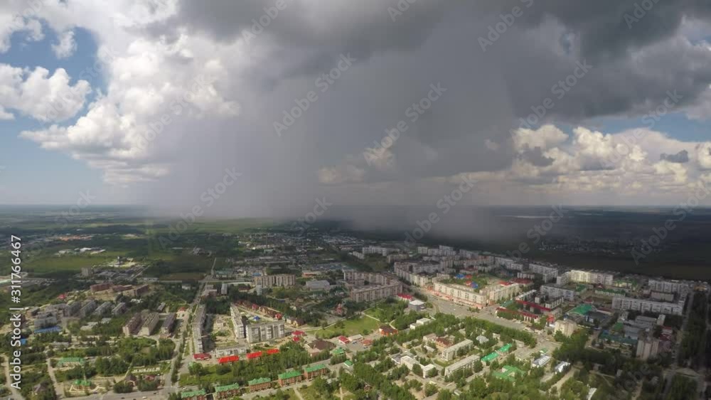 Stormy front over the city, aerial view of rain and thunder. Stormy front over the city, aerial view of rain and thunder.