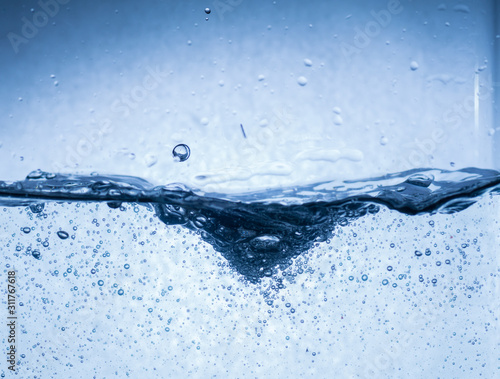splash of water in blue background
