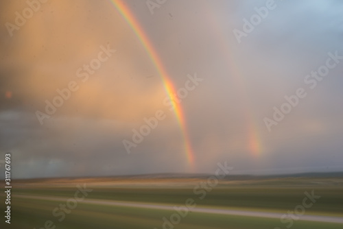 Double rainbow from moving train