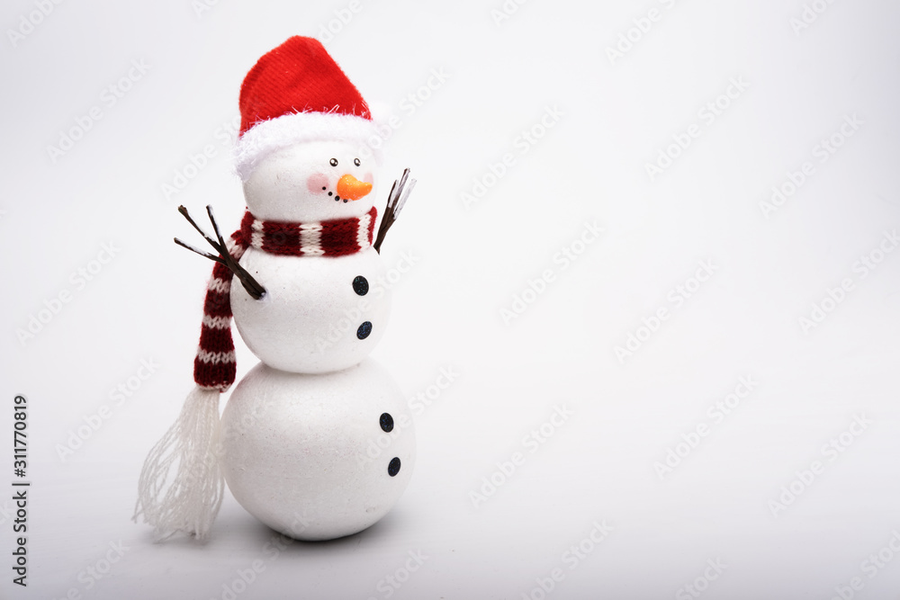 Snowman in a red cap on a white background