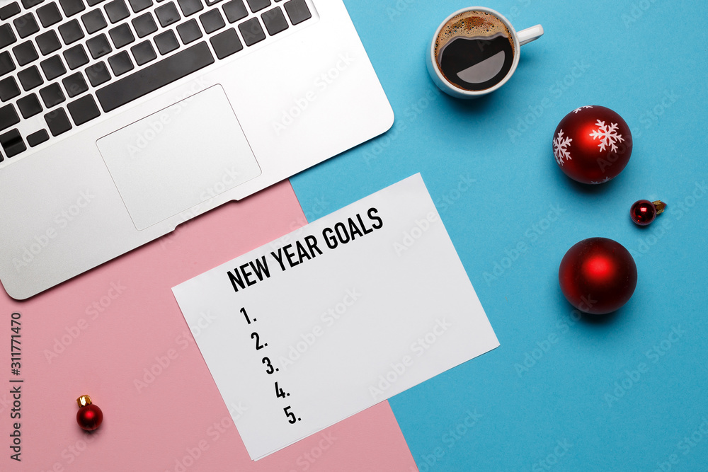 Global New Year Goals Concept. Notepad, Christmas Toys, Laptop, Top View Flat lay. Business, Motivation, Personal Growth, Inspiration, Success Global New Year Goals Concept. Notepad, Christmas Toys, Laptop, Top View Flat lay. Business, Motivation, Personal Growth, Inspiration, Success