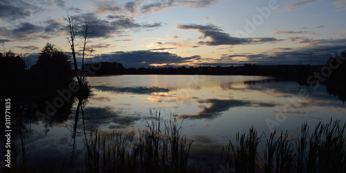 Autumn sunset over the lake. Beautiful panorama