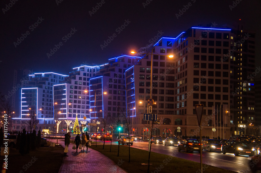 Glowing buildings at night. Illumination back Christmas and New Year. Minsk, Belarus. December 24, 2019