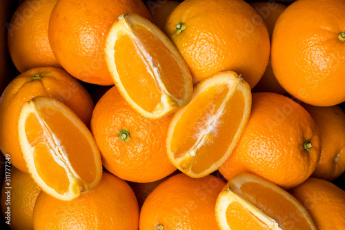 Case of fresh navel oranges. photo