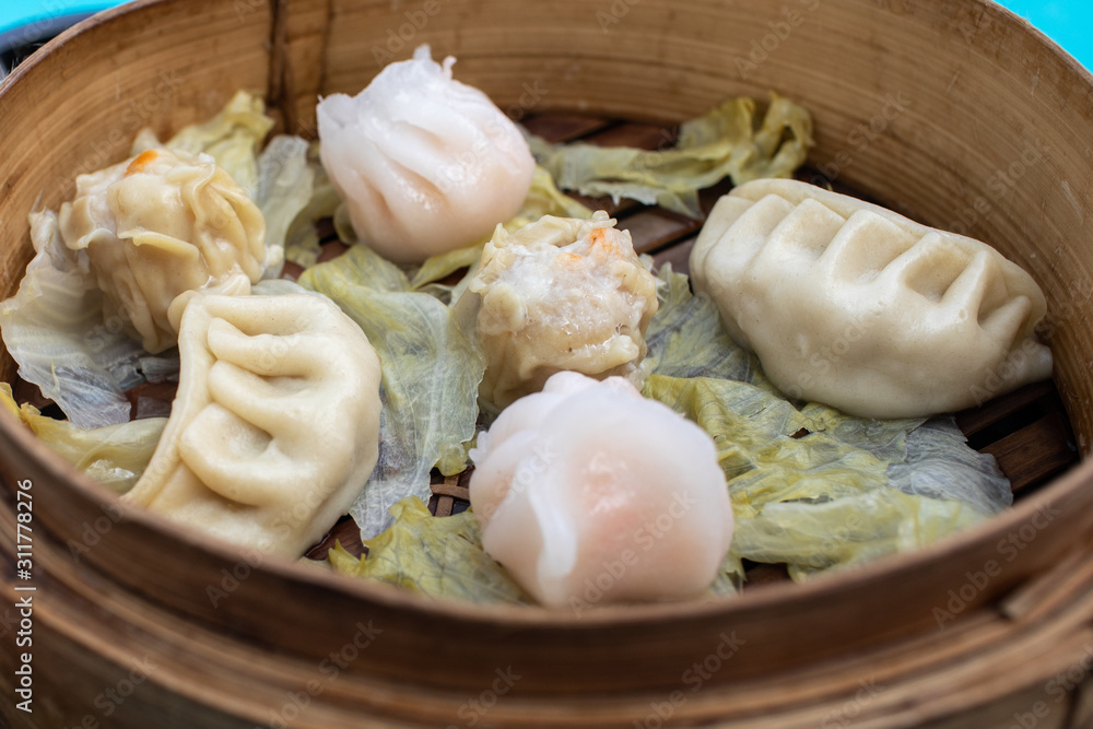 Gyoza in wooden basket are Traditional Japan food Gyoza in wooden basket are Traditional Japan food