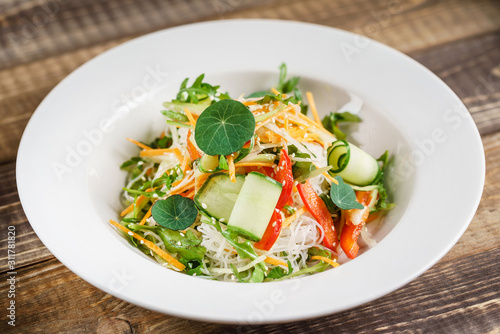 fresh spring salad on the wooden background