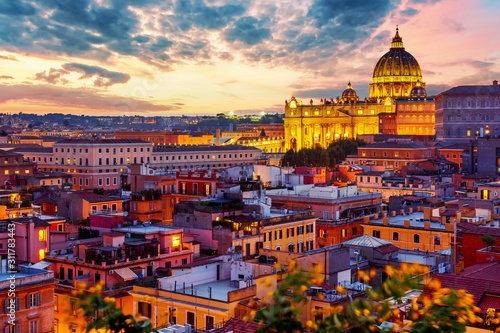 Canvas Print Cityscape view of Rome at sunset with St Peter Cathedral in Vatican