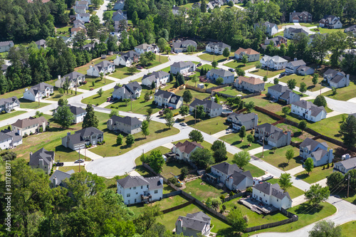 Aerial view of modern suburban cul-de-sac neighborhood streets in the southeastern United States. 