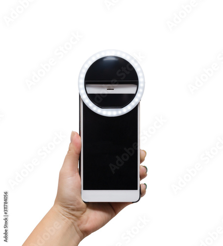 hand holding smarthone with selfie ring lamp