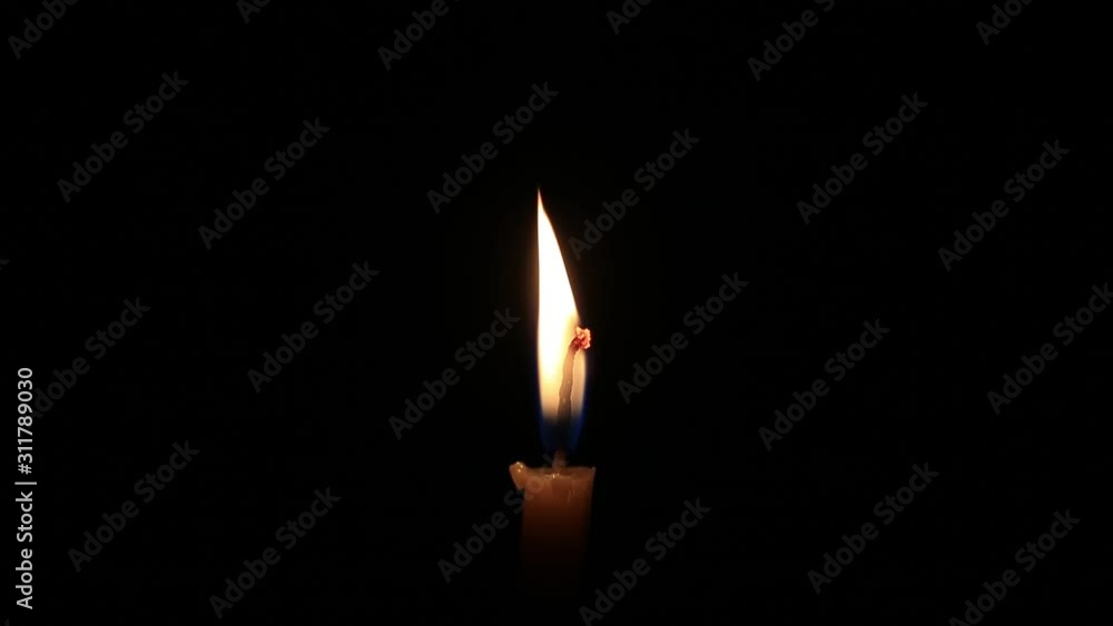 Burning candle isolated on black background, concept of mourning, sadness, sorrow. Commemoration day. Burning candle isolated on black background, concept of mourning, sadness, sorrow. Commemoration day.