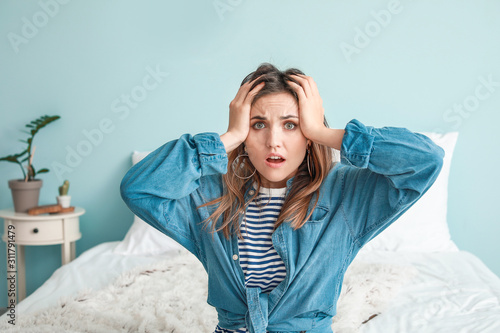 Portrait of worried young w...