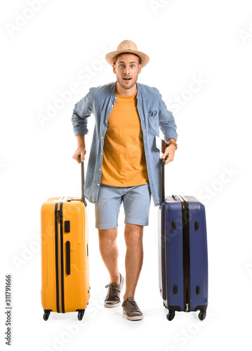 Young tourist with luggage ...