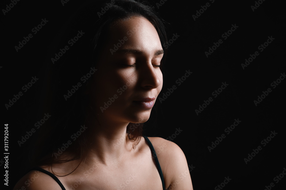 Silhouette of beautiful young woman on dark background Silhouette of beautiful young woman on dark background