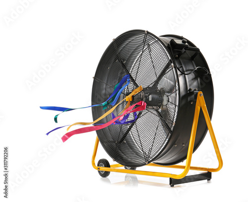 Electric fan with fluttering ribbons on white background © Pixel-Shot