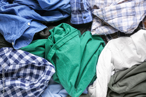 Heap of different clothes, top view