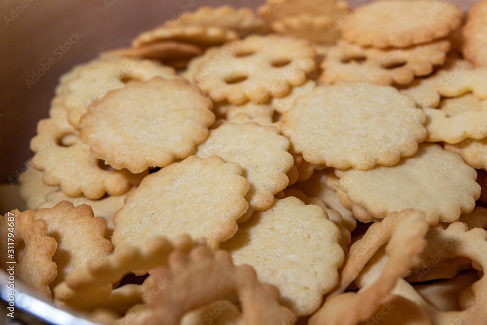 Freshly baked christmas cookies on baking sheet.