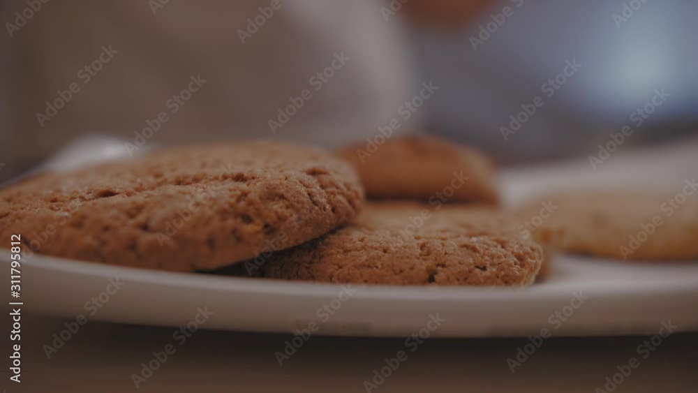 Close-Up Of A Man Taking A Cookie In The Morning. Close-Up Of A Man Taking A Cookie In The Morning.