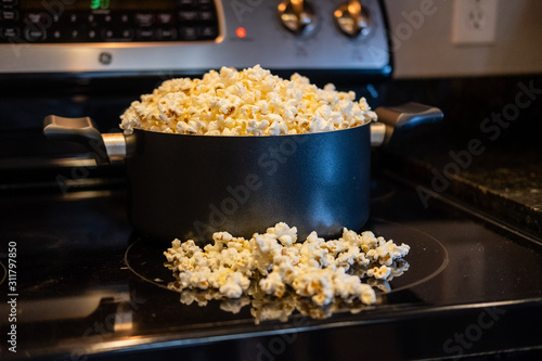 homemade popcorn overflowing in pot