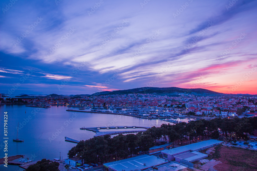 Fototapeta premium Vodice, Croatia / 17th May 2019: Sunset in Vodice, blue hour seafront aerial view