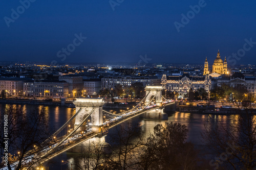 Chain bridge (Szechenyi Bridge) , danube palace and st Stephen's basilica at dusk, Budapest, Hungary