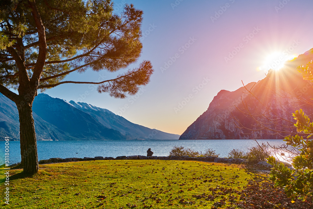 Beautiful and colorful autumn in Riva del Garda, Garda lake surrounded by mountains, Trentino Alto Adige region, Lago di garda, italy