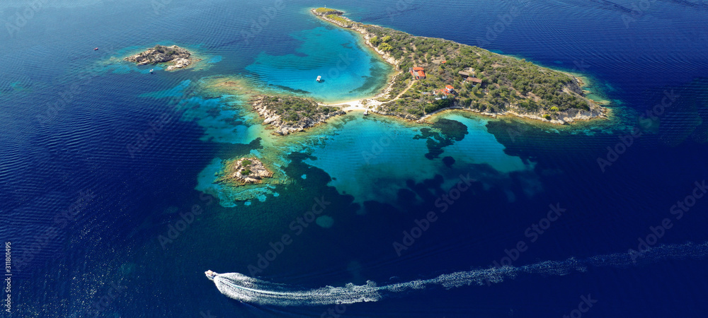 Aerial drone ultra wide photo of exotic sandbar peninsula forming turquoise clear sea beaches in tropical island destination Aerial drone ultra wide photo of exotic sandbar peninsula forming turquoise clear sea beaches in tropical island destination