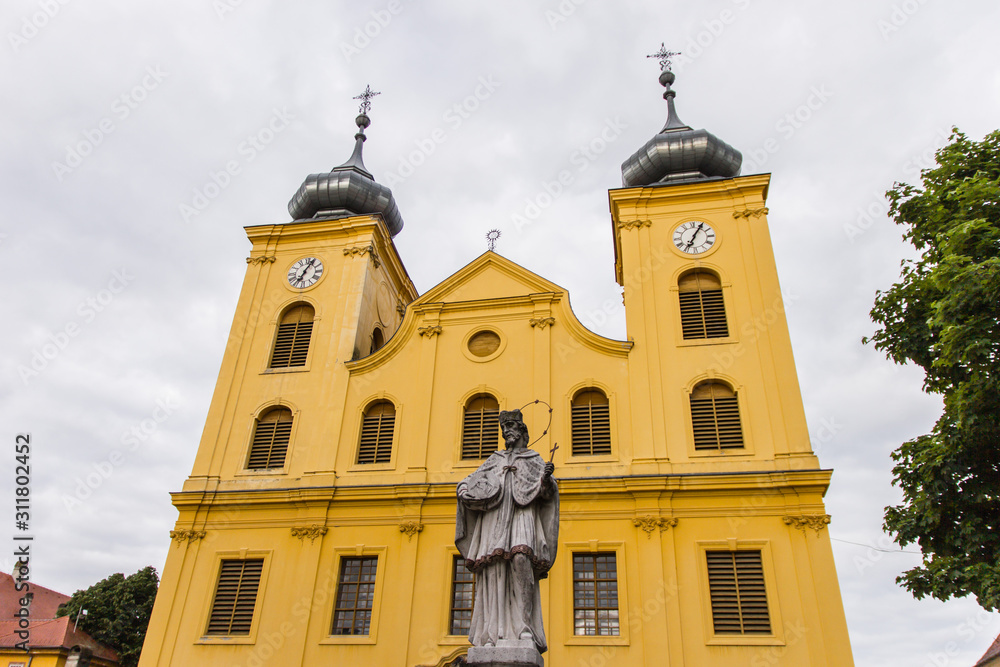 Osijek / Croatia: 10th May 2019: Saint Mihael church and Ivan Nepomuk statue inside medieval fortification tvrdja in Osijek