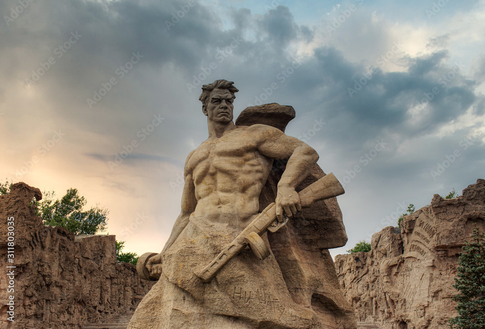 Russia, Volgograd - August 20, 2017: Sculpture The Motherland Calls! and the Monument to Stand to the Death. Monument-ensemble to Heroes of Battle of Stalingrad on Mamayev Kurgan.