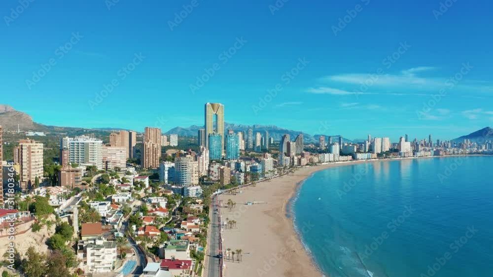Spanish city Benidorm buildings and sandy beach Poniente. Aerial view. Spanish city Benidorm buildings and sandy beach Poniente. Aerial view.
