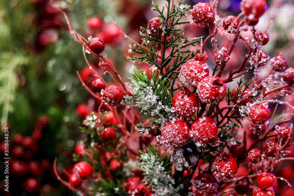 Arrangement of Christmas berry holly or ilex twigs, red balls as a home decorations for the Christmas New Year holidays. Arrangement of Christmas berry holly or ilex twigs, red balls as a home decorations for the Christmas New Year holidays.