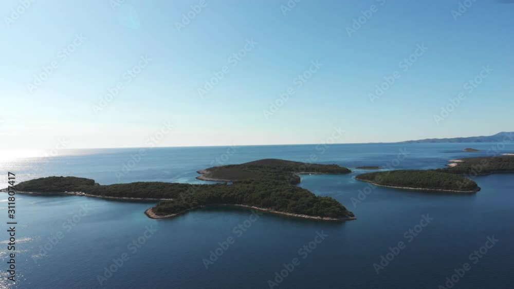 Drone pushing up on small Croatian islands in the blue Adriatic sea Drone pushing up on small Croatian islands in the blue Adriatic sea