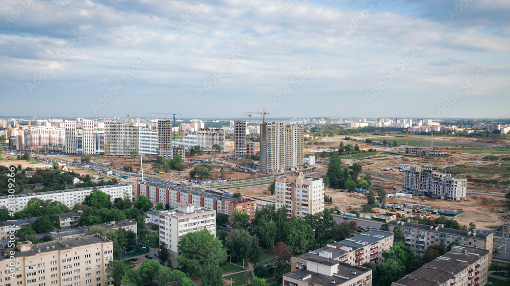 Residential neighborhoods, new building and private homes. The city is advancing. Construction of the Minsk City microdistrict in Minsk.