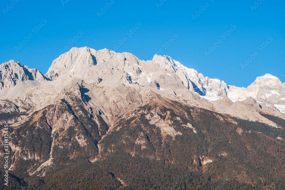 Beautiful of Jade Dragon Snow Mountain or Yulong in Chinese language, landmark and popular spot for tourists attractions near Lijiang Old Town. Lijiang, Yunnan, China